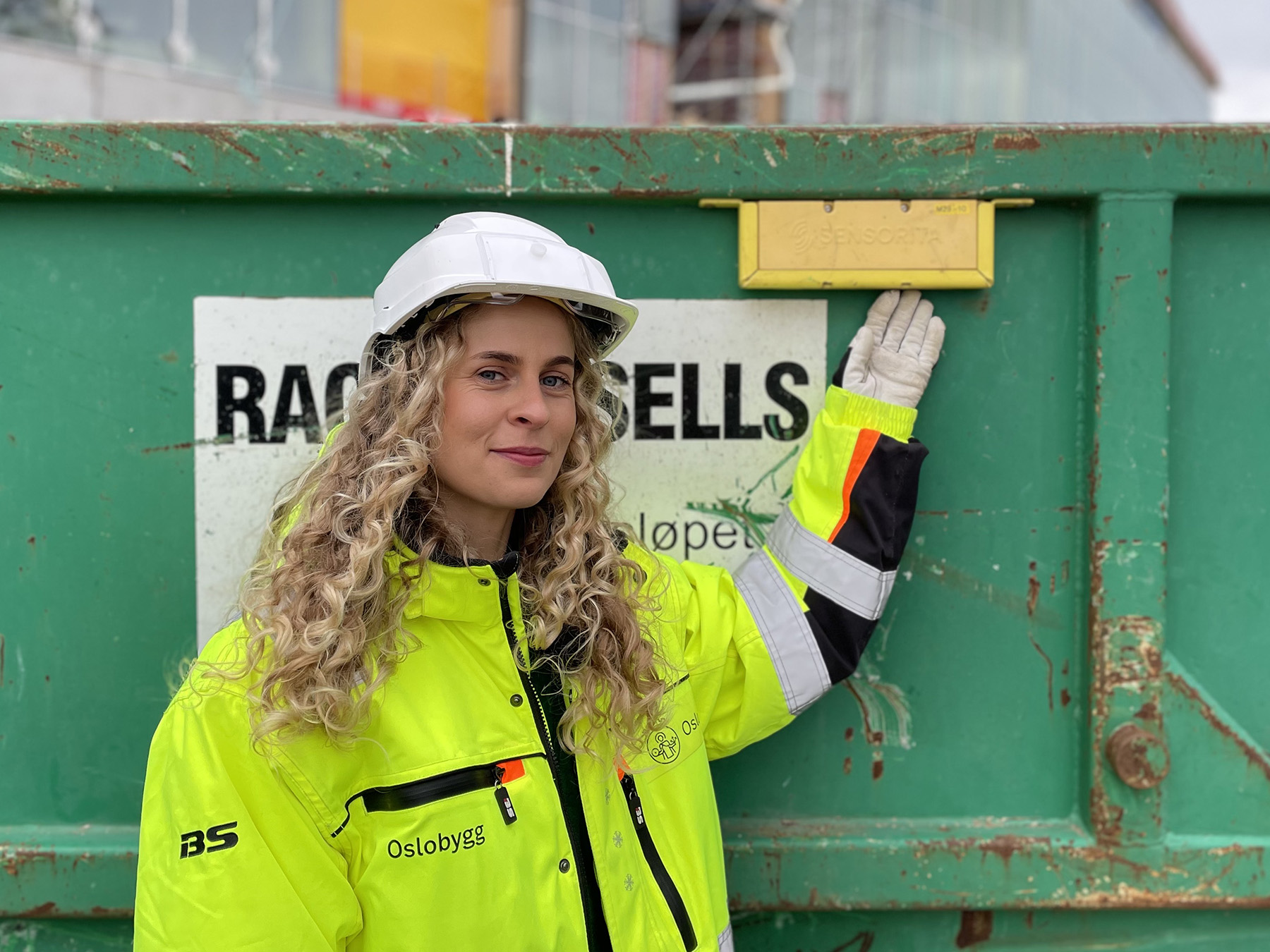 a woman standing in front of a building