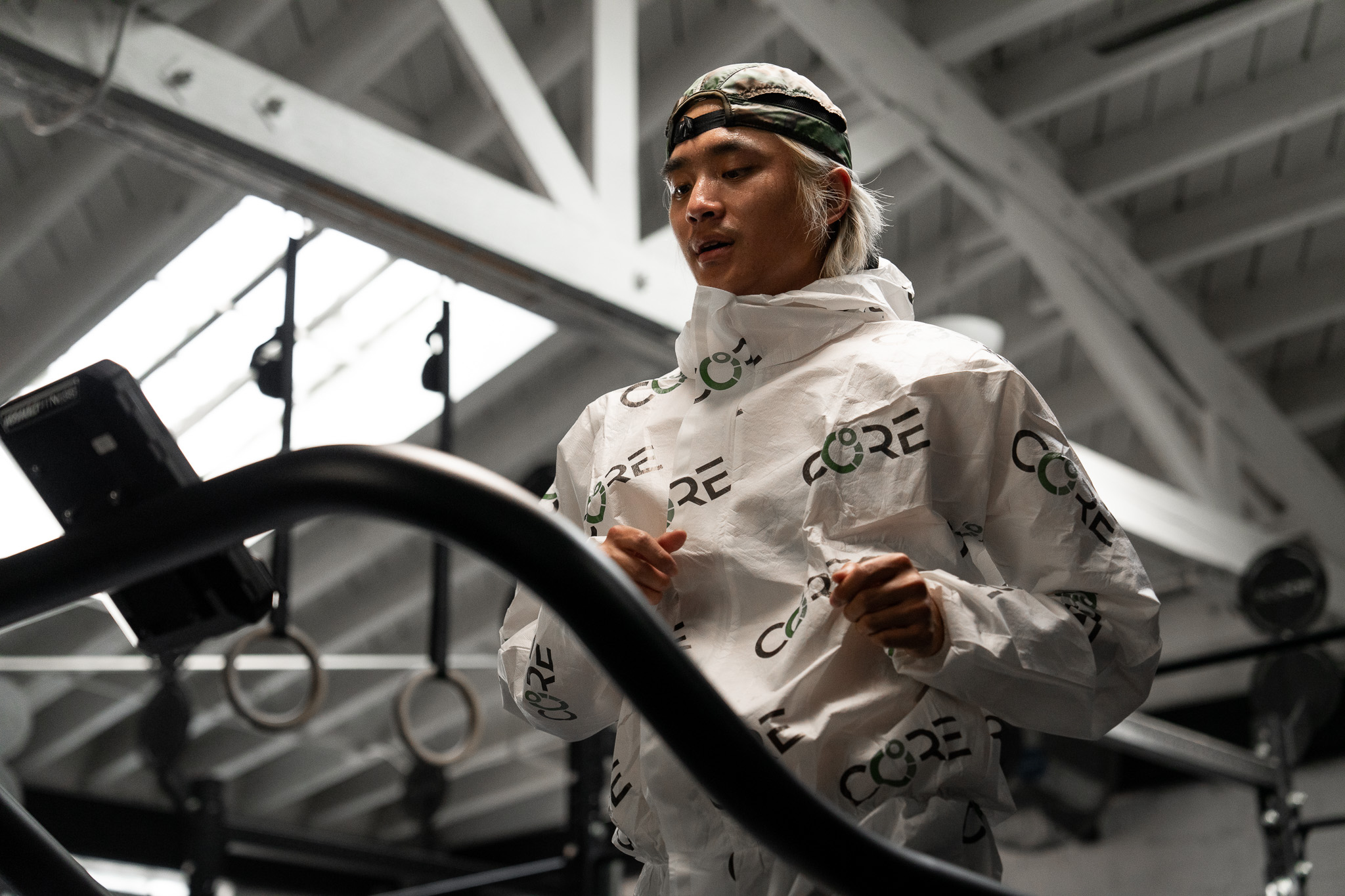 a man standing in front of a mirror posing for the camera